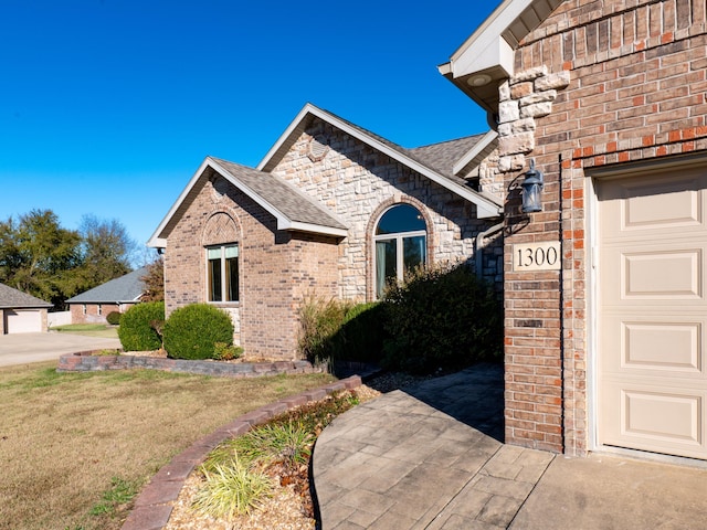 exterior space with a garage and a front yard