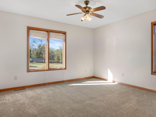 carpeted empty room with ceiling fan