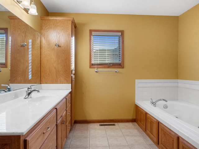 bathroom with vanity, a tub to relax in, and tile patterned floors