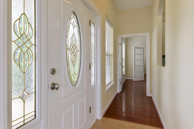 foyer with light hardwood / wood-style floors