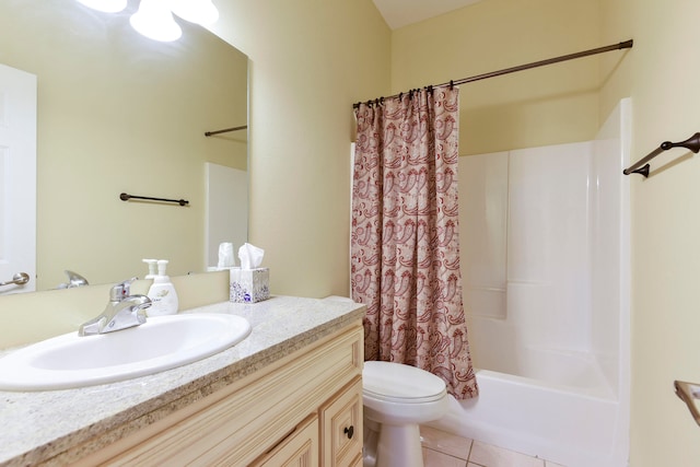 full bathroom with toilet, vanity, tile patterned floors, and shower / tub combo