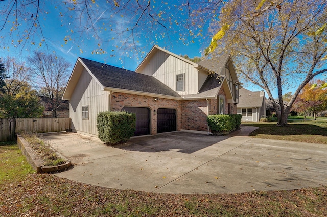 view of side of home with a garage