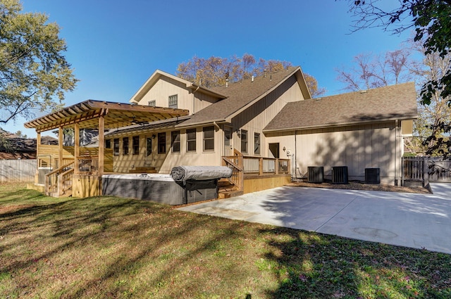 rear view of house with central AC, a lawn, a deck, and a patio area