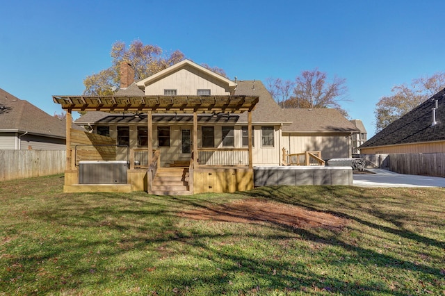 rear view of house with a pergola, a patio, and a yard