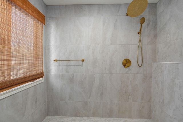 bathroom with a tile shower