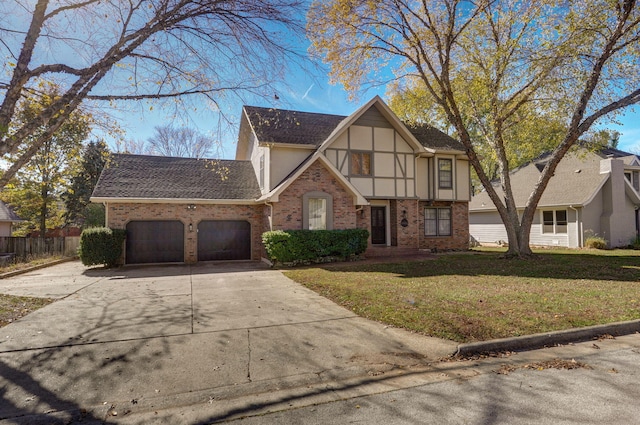 view of front of property with a garage and a front yard