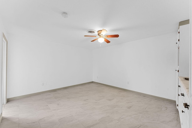 spare room with ceiling fan