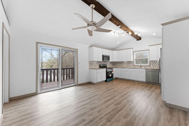 kitchen with white cabinetry, stainless steel appliances, light hardwood / wood-style flooring, and plenty of natural light