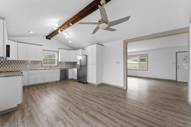 kitchen featuring white cabinets, light wood-type flooring, a wealth of natural light, and stainless steel appliances