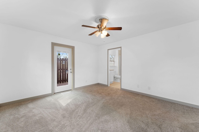 empty room with light carpet and ceiling fan