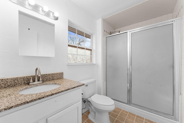 bathroom featuring walk in shower, vanity, and toilet