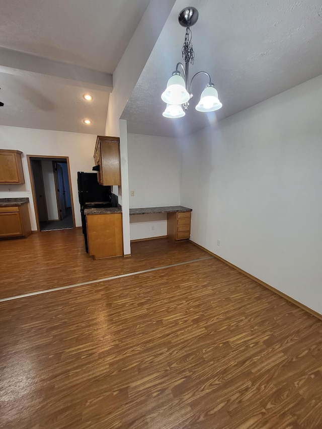 kitchen with an inviting chandelier, dark hardwood / wood-style floors, and decorative light fixtures