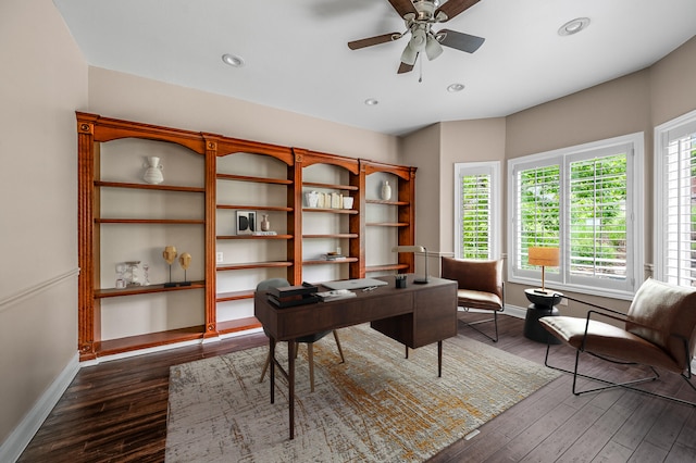 office space featuring dark hardwood / wood-style flooring and ceiling fan