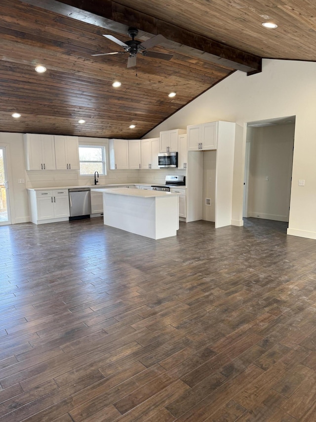 kitchen with wooden ceiling, stainless steel appliances, dark wood-style flooring, and light countertops