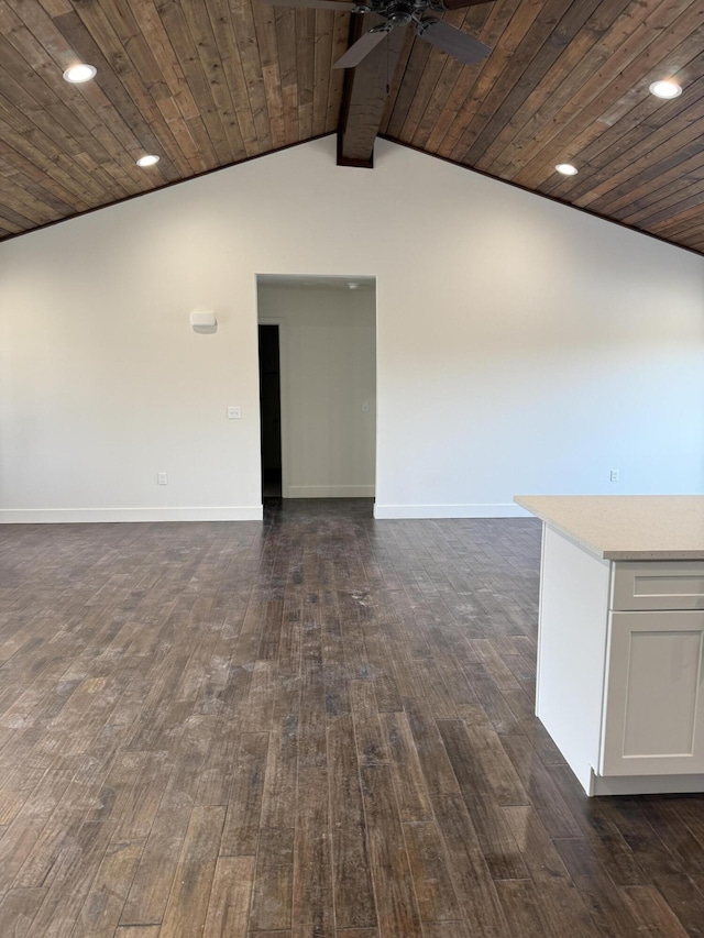 unfurnished room with vaulted ceiling, dark wood-type flooring, wooden ceiling, and baseboards