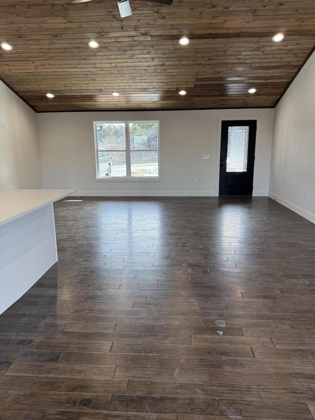 interior space with dark wood-style floors, recessed lighting, wooden ceiling, and baseboards