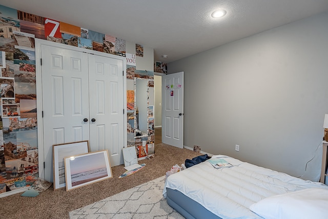 carpeted bedroom featuring a closet