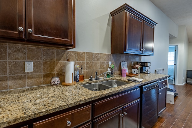 kitchen featuring light stone countertops, sink, decorative backsplash, dishwasher, and dark wood-type flooring