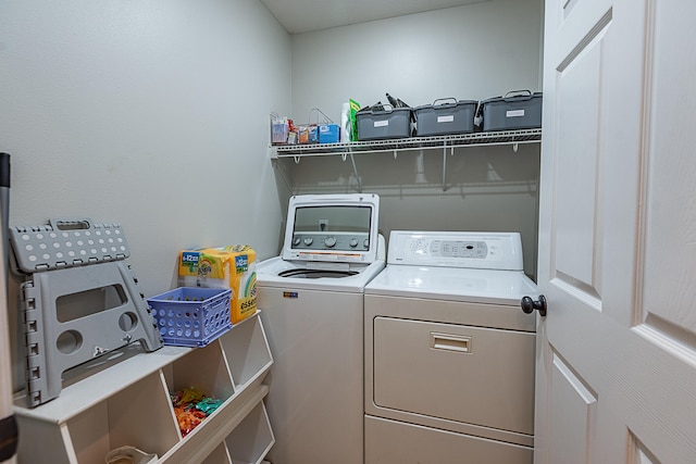 laundry area with washing machine and dryer