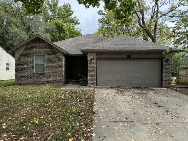 ranch-style home with a garage