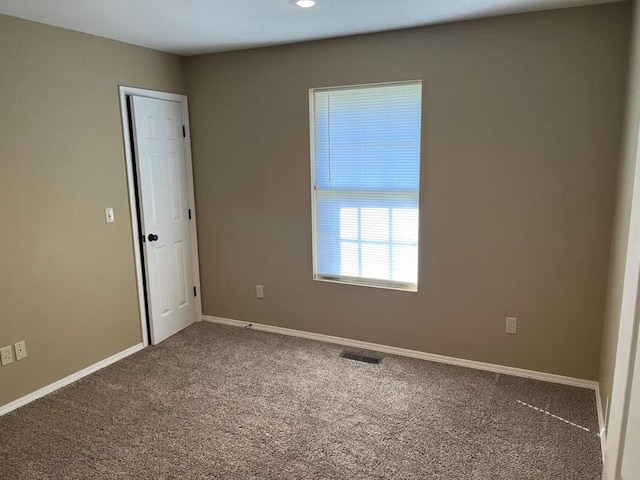 unfurnished room with carpet