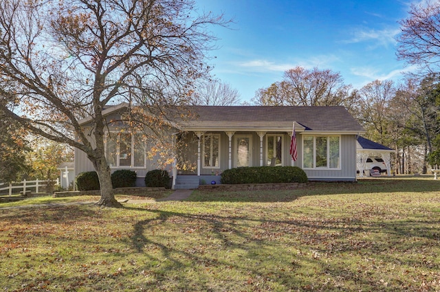 ranch-style home featuring a front yard