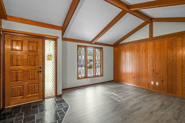 entryway with lofted ceiling with beams, dark wood-type flooring, and wooden walls