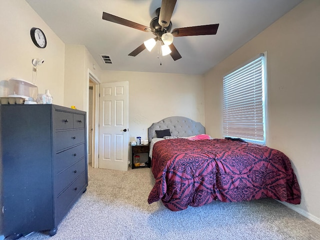 bedroom featuring light carpet and ceiling fan