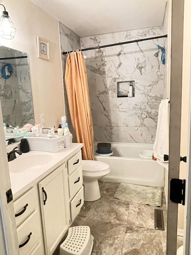 full bathroom featuring vanity, toilet, and shower / tub combo