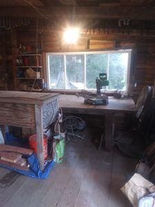 misc room featuring wooden walls and hardwood / wood-style flooring