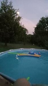 view of pool at dusk