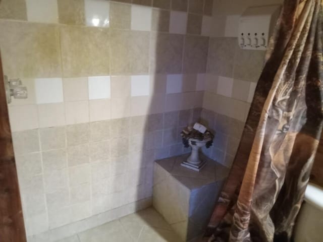 bathroom featuring walk in shower