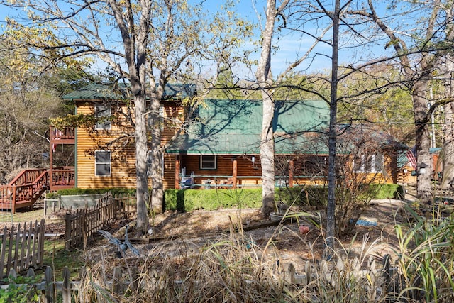 rear view of house with a wooden deck