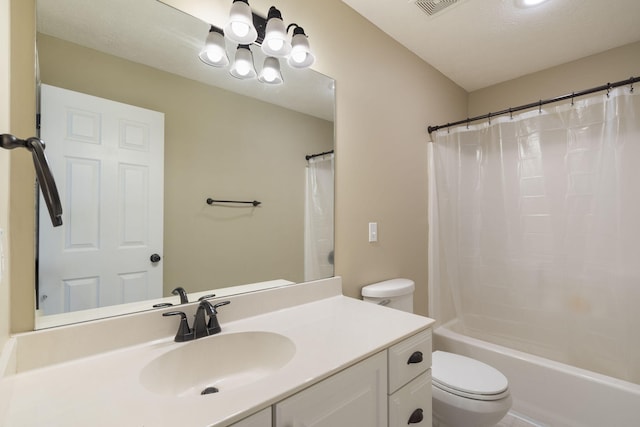 full bathroom with toilet, shower / bath combo, vanity, and a textured ceiling