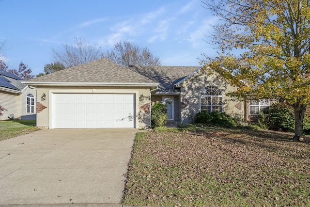 ranch-style home featuring a garage