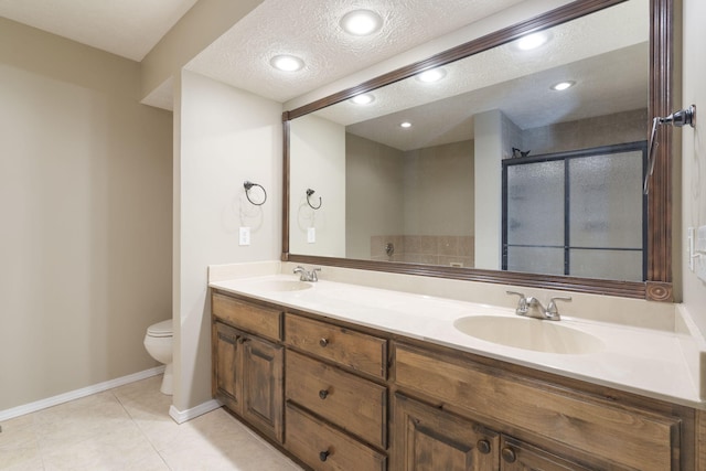 430 S Yellowwood Dr, Springfield, MO 65809 - full bath featuring toilet, a textured ceiling, a stall shower, double vanity, and tile patterned flooring