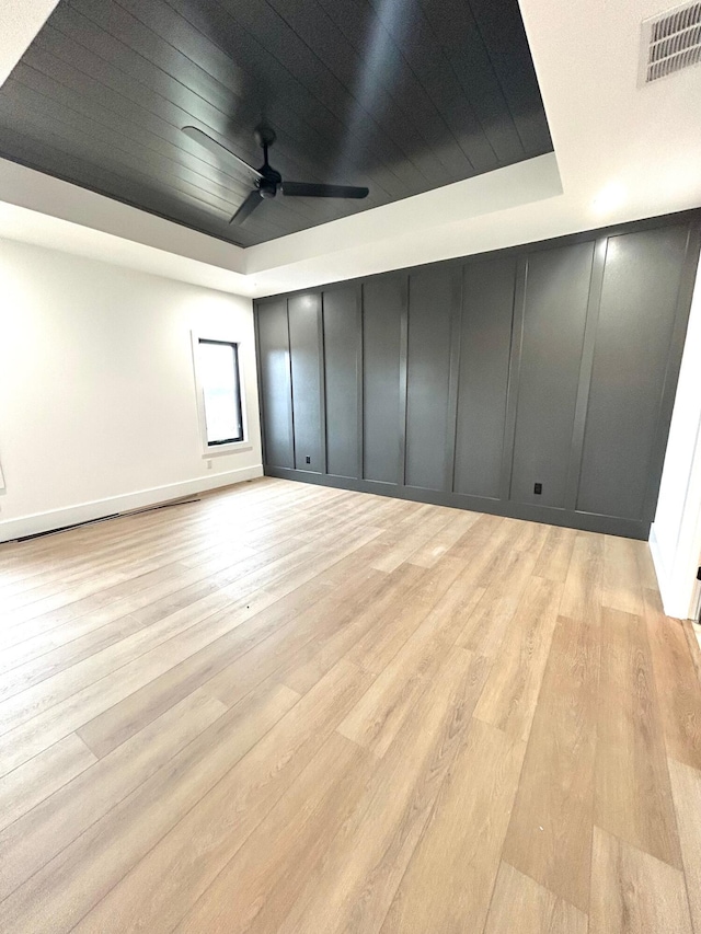 additional living space featuring light hardwood / wood-style floors, ceiling fan, and wooden ceiling