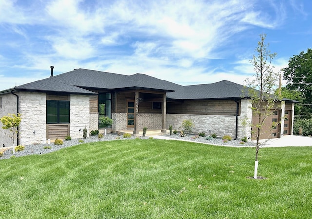 2979 E Kemmling Ln, Springfield, MO 65804 - prairie-style home with stone siding, a front yard, covered porch, and a shingled roof
