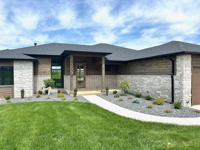 2979 E Kemmling Ln, Springfield, MO 65804 - view of front facade with a front yard, a garage, stone siding, and a shingled roof