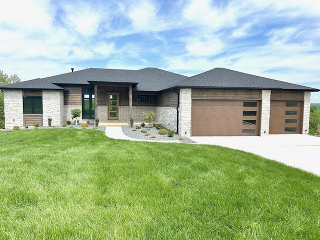 2979 E Kemmling Ln, Springfield, MO 65804 - prairie-style house with stone siding, a garage, driveway, and a front yard