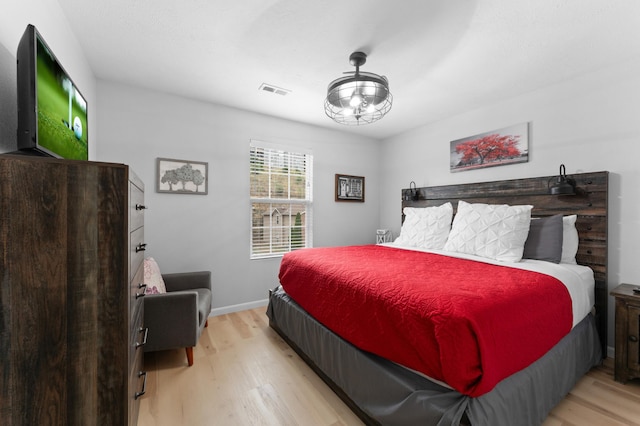 bedroom with light hardwood / wood-style floors