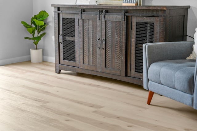 sitting room with light hardwood / wood-style flooring