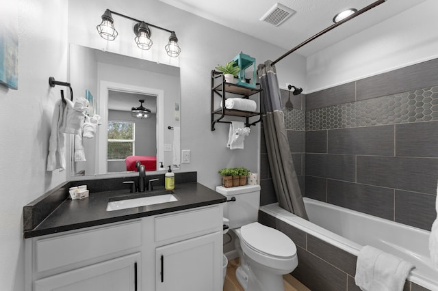 full bathroom with vanity, a textured ceiling, shower / bath combo, toilet, and ceiling fan