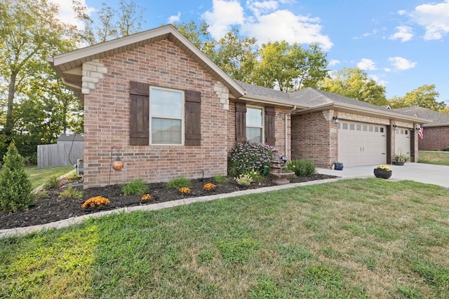 view of front of home featuring a garage and a front yard