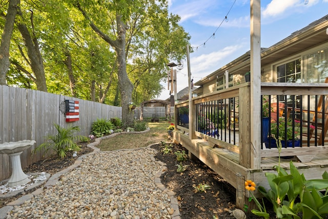 view of yard with a wooden deck