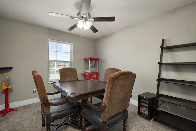 carpeted dining area featuring ceiling fan