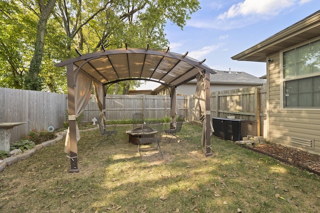 view of yard featuring a pergola and an outdoor fire pit