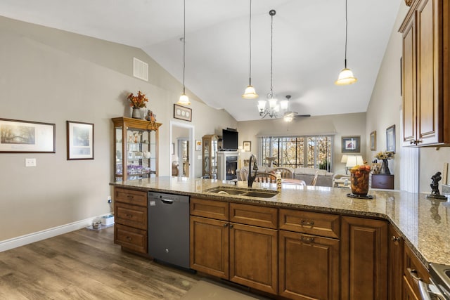 kitchen with ceiling fan, dishwasher, sink, decorative light fixtures, and hardwood / wood-style flooring