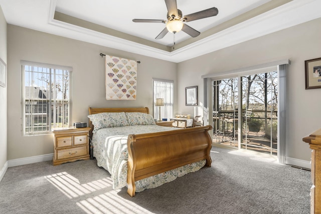 311 Cedar Glade Dr, Branson West, MO 65737 - carpeted bedroom with access to exterior, a tray ceiling, baseboards, and ceiling fan