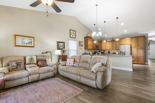 living room featuring ceiling fan with notable chandelier, dark hardwood / wood-style floors, and lofted ceiling